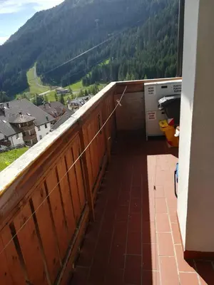 a balcony with a view of a mountain at Appartamento Gliera in Arabba