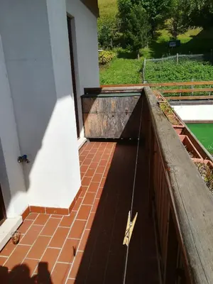 a view of a porch with a tiled floor at Appartamento Gliera in Arabba