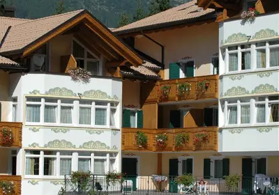 a group of buildings with windows and balconies at Residence Pez Gajard in San Martino di Castrozza