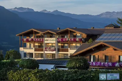 a hotel with a view of the mountains at Hotel St. Anton in Fiè