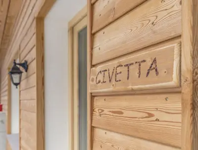 a wooden door with the word cuisinart written on it at Residence Civetta in Val di Zoldo