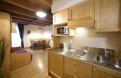 a kitchen with a sink and a counter top at Residence Civetta in Val di Zoldo