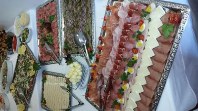 a table topped with different types of meats and cheese at Hotel Rose in Villabassa