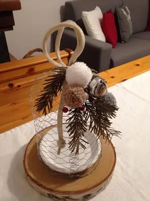 a cake with a christmas ornament on a table at il bosco in casa in Telve