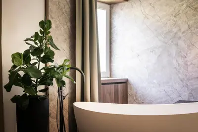 a bathroom with a sink and a shower at Alpstay - Hotel Acadia - Adults Mountain Home in Selva di Val Gardena