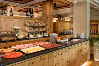 a buffet with many different types of food on display at Aktiv & Relax Hotel Hubertus in Villandro