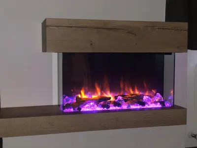 a fireplace is shown with flames in it at Hotel Residence Rosa in San Lugano