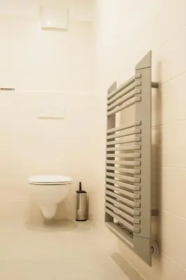 a white bathroom with a toilet in a room at b&b Casa Tavernaro in Fiera di Primiero