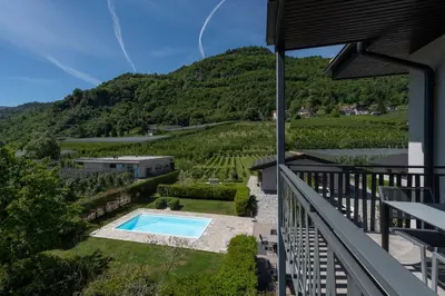 a view from the balcony of a house with a swimming pool at Untermargarethenhof in Lana