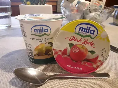 a can of milk and a spoon on a table at Gruppenhaus Thalackerhof in Brunico