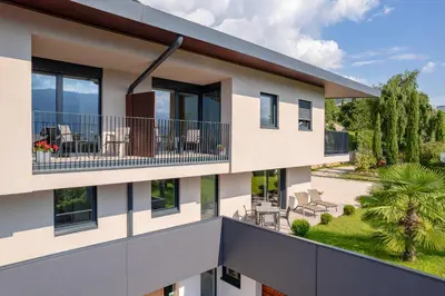 an exterior view of a building with a balcony at Tholr - Ferienwohnungen - Tramin in Termeno