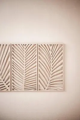 a white wall with a window with a pattern on it at Appartementhaus Residence Hirzer in Tirolo