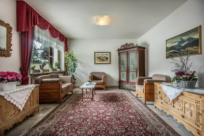 a living room with couches chairs and a table at Medesc in La Villa