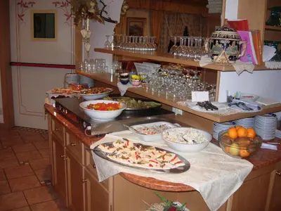 a buffet line with many different types of food at Hotel Albe in Rocca Pietore