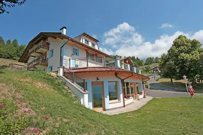 a house on the side of a hill at Residence Villa Boschetto in Carano