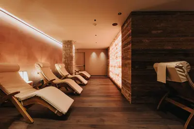 a row of chairs in a waiting room at Vitalhotel Dosses in Santa Cristina in Val Gardena