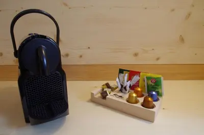 a black object sitting on a table next to a box at Villa Hubertus in Ortisei