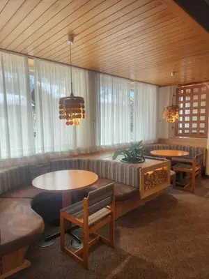 a bedroom with two beds with white pillows at Hotel Villa Rosa in Campitello di Fassa