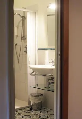 a bathroom with a sink and a mirror at Antica Trattoria in Cles