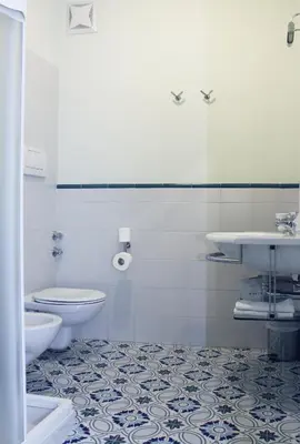 a bathroom with a toilet and a sink at Antica Trattoria in Cles