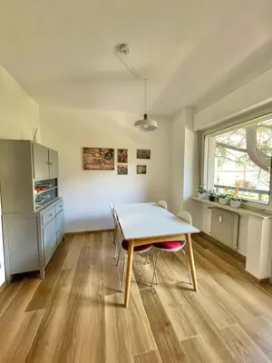 a dining room with a table and chairs in a room at Residenza XXX Aprile in Merano