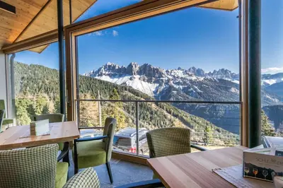 a restaurant with a view of the mountains at Berghotel Schlemmer in Bressanone