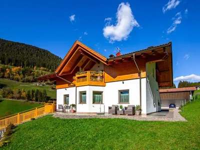 a door leading into a room with wooden dividers at Apartment Spieglhof-2 by Interhome in Sarntal