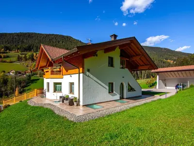 a bed with a pillow on it in a bedroom at Apartment Spieglhof-1 by Interhome in Sarntal