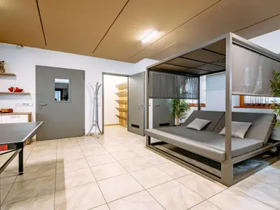 a large bed sitting in a room with a window at Apartment Spieglhof-1 by Interhome in Sarntal