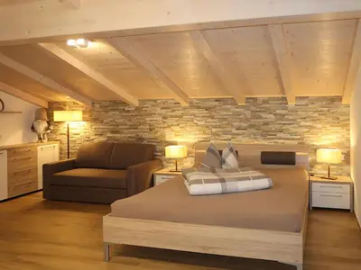 a house with a balcony in the snow at Apartment Spieglhof-3 by Interhome in Sarntal