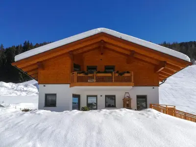 a house on a hill in a green field at Apartment Spieglhof-3 by Interhome in Sarntal