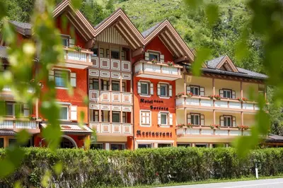 a large building with a lot of windows at Hotel Foresta in Moena