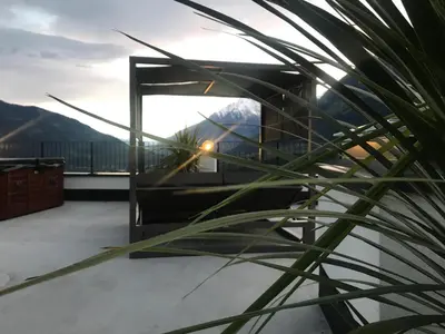 a view of the mountains from the roof of a house at Antonya Apartments in Schenna