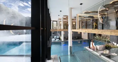 a view of a swimming pool from a house at Wellness Hotel Gran Risa***S in La Villa