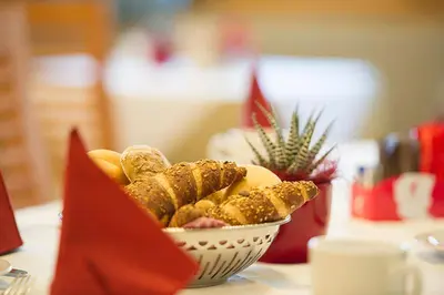 a bowl of food sitting on top of a table at PENSION KLUGHAMMER in Caldaro