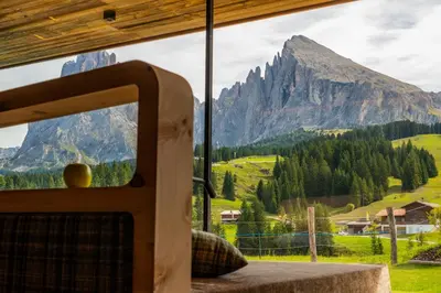 a large swimming pool with a large tub in a building at Saltria - your Alpine experience in Alpe di Siusi