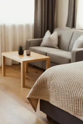 a living room with a couch and a coffee table at Hotel Genziana in Ortisei
