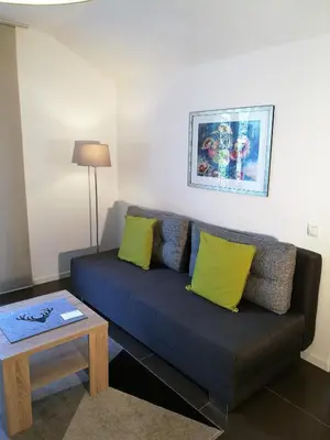 a living room with a couch and a table at Residence Reinhild in Nalles