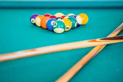 a group of cue balls on a pool table at Hotel Villa Imperina in Agordo