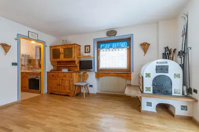 a kitchen with an old fashioned stove in a room at Casa Riccardo in Soraga