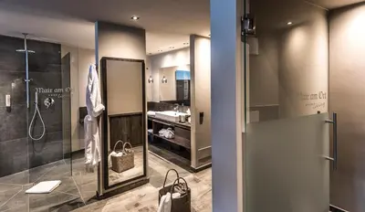 a bathroom with a shower and a sink at Mair Am Ort Living Hotel B&B in Parcines