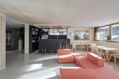 a living room with a couch and a table at Hotel Gardenazza in Badia