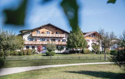 a large house in the middle of a field at hubertus dolomites in Fiè
