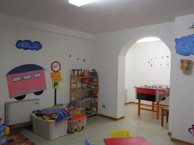 a childs room with a train mural on the wall at Hotel Cima Dodici in Vigo di Fassa