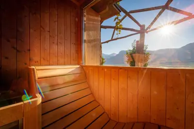 a sauna with a window with a view of the ocean at Panorama in Termeno