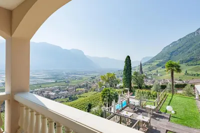 a balcony with a view of a valley and mountains at Panorama in Termeno