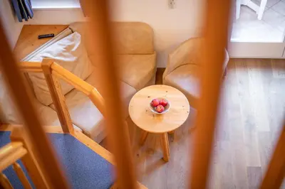an aerial view of a living room with a table and a couch at Gartenheim Tramin in Termeno