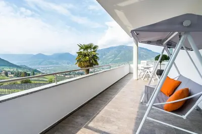 a balcony with a view of the mountains at Apartments Graf Hartwig in Schenna