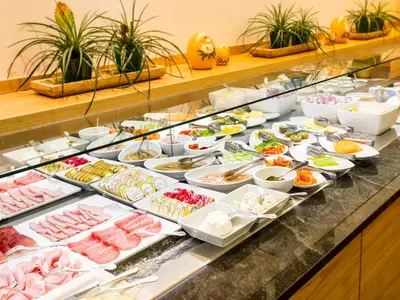 a buffet with many different types of food on display at Alpin & Vital Hotel La Perla in Ortisei