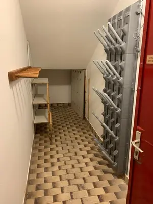 a hallway with a bunch of baseball bats on the wall at Appartamenti Col Rodella by AMA Val di Fassa in Campitello di Fassa